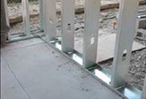 Attach exterior perimeter track to concrete